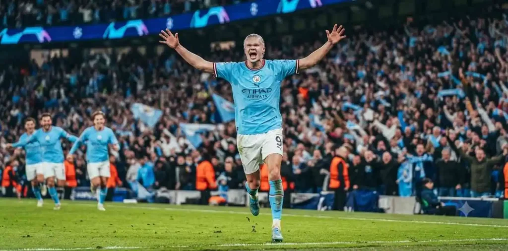 Football player celebrating a winning goal with teammates