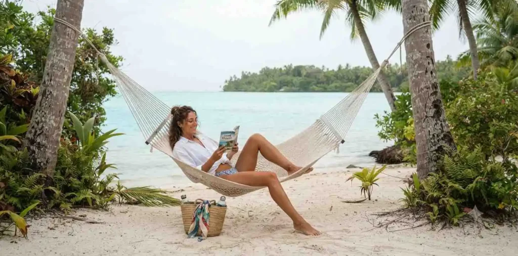 Traveler relaxing in a tropical island hammock