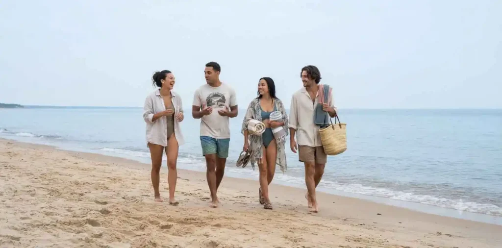Friends walking together along a quiet beach