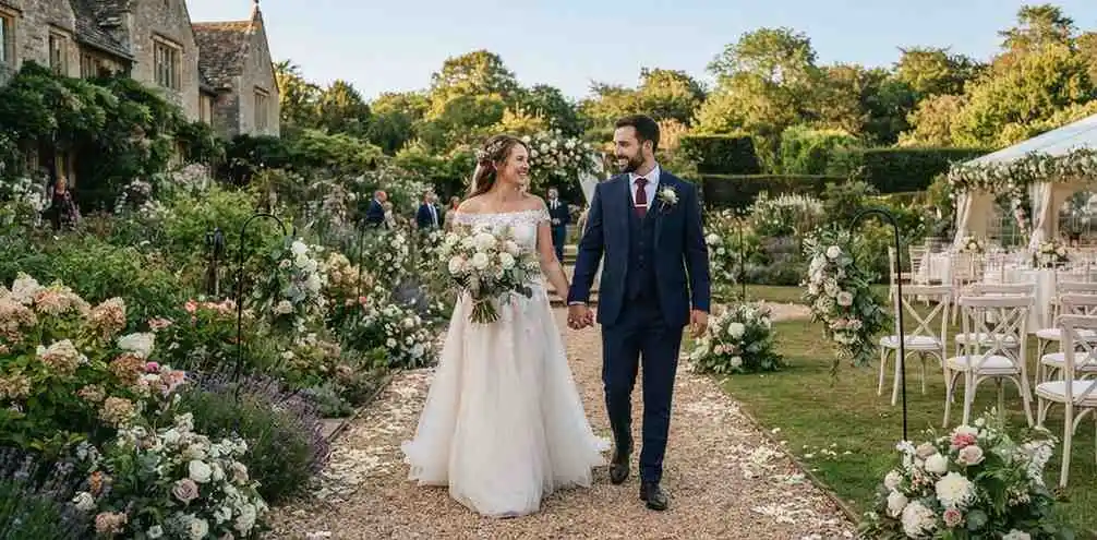 Newlywed couple walking through elegant wedding venue